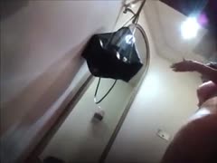 In the changing room, a gorgeous, curvaceous mother is being filmed by a hidden camera.